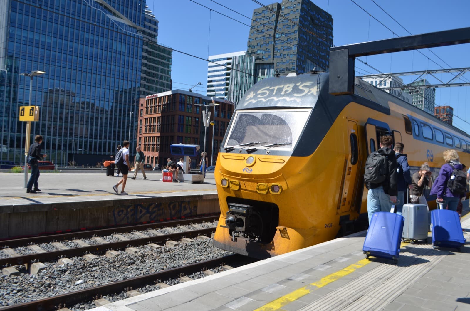 Travelers boarding an Intercity at Amsterdam Zuid